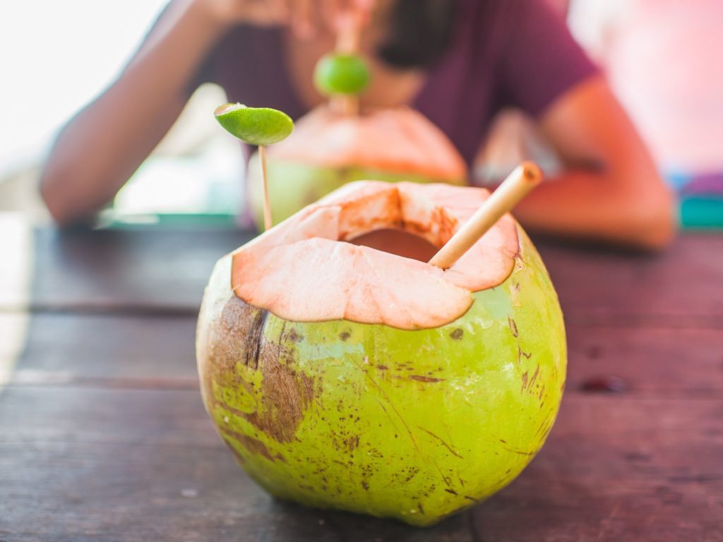 A bamboo straw in a tropical drink.