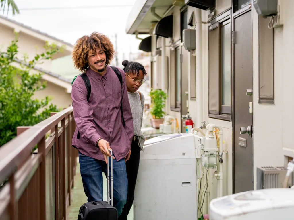 Tourist couple checking into their vacation homestay rental.